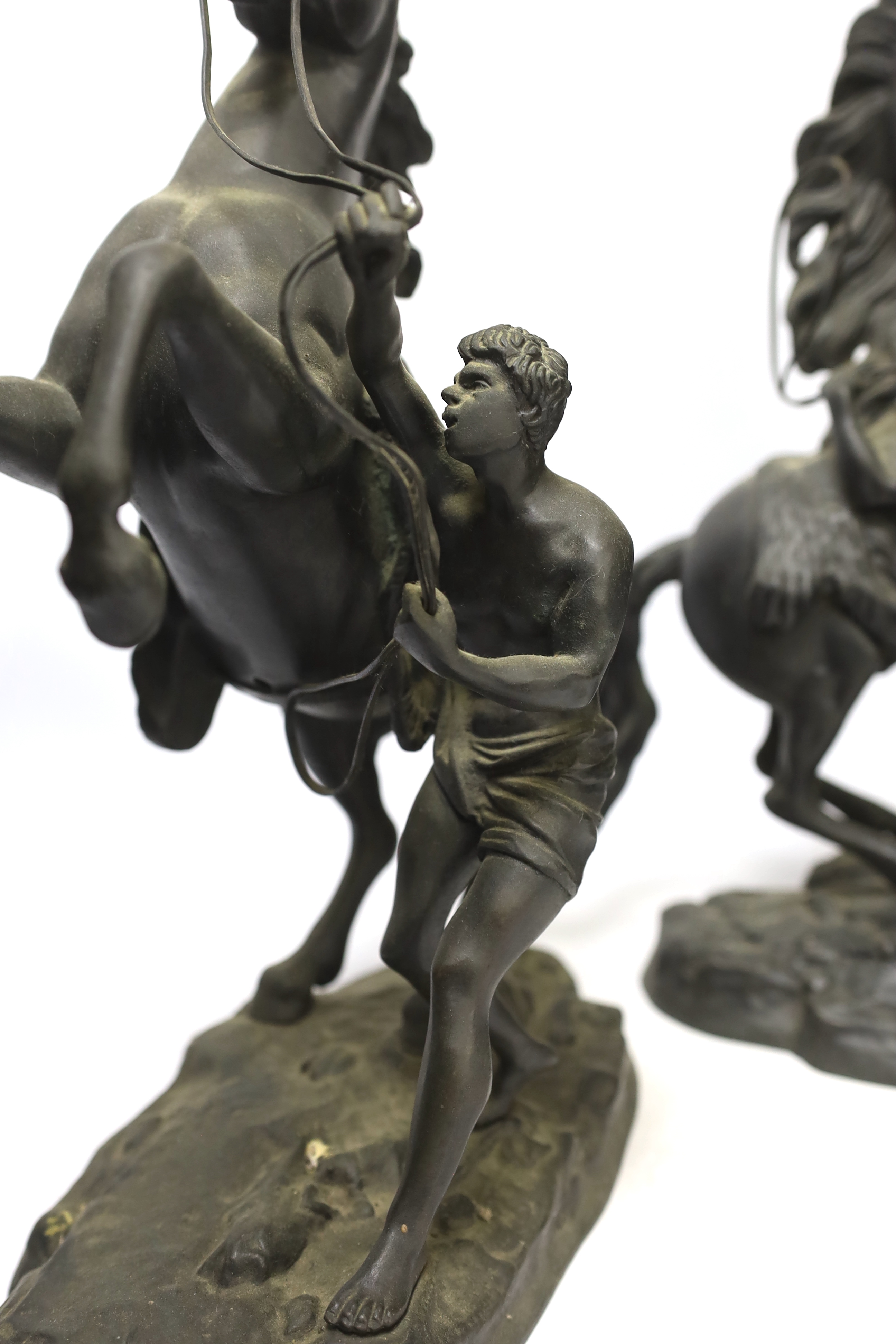 After Guillaume Coustou (1677-1746), a pair of bronze Marly horses, 37cm